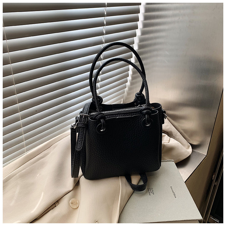 Fashionable and simple solid color handbag, versatile retro bucket bag shoulder messenger bag